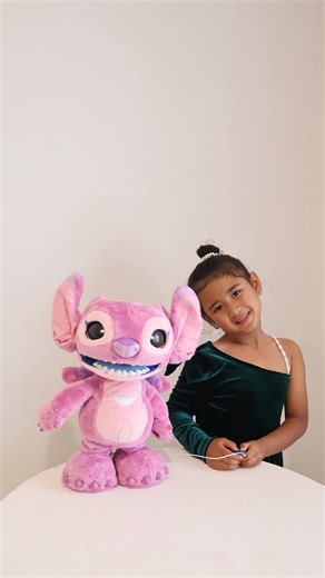 Nimzychon on Instagram: "Syrah is obsessed with the new Ultimate Angel interactive plush! This cute (and sometimes feisty!) alien has over 100 sound and motion combos. Syrah’s been tapping her nose, belly and even her tongue just to see what Angel does next… from blowing kisses and giggling to full-on alien tantrums and adorable purrs. 😅✨ Perfect Christmas Gift 🎁 idea!!!! Hold her hand to calm her down, double tap to bring out her sass. It’s honestly the funniest little personali