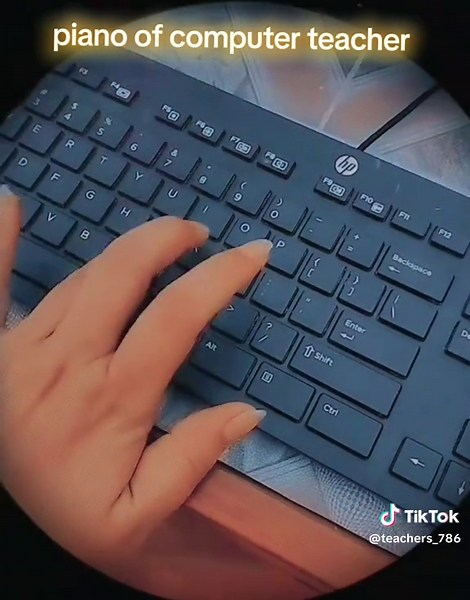 Teacher Plays Computer Keyboard Like Piano