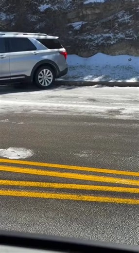 Jane Hodges on Instagram: "Witness a harrowing, yet incredibly fluid, real-life driving incident captured from a trailing dashcam POV. This video shows a silver Ford Explorer SUV cautiously approaching a winding hillside road, unaware of the thin black ice patches hidden beneath light snow. At the 3-second mark, the SUV hits the treacherous black ice. Its wheels lock, and the vehicle begins an uncontrolled, slow-motion rotation, drifting sideways down the slope as it completes a full 360-degree 