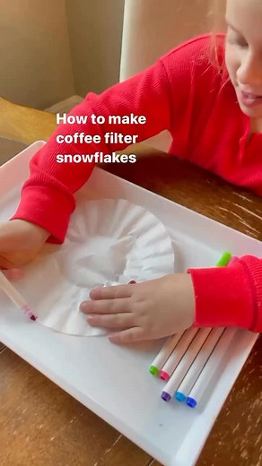 We love this arts and craft activity in the winter! Here’s how to make the snowflake coffee filters: Use washable markers and color all over the coffee filters. Spray water all over the filters and let them dry completely. I usually put them on top of paper towels while they dry. Fold the filters like the video, in half first. Then fold 1/3 over, 1/3 over again, and then fold in half one last time. Use scissors to cut however you wish, then open up and admire! Save this activity for your kids (a