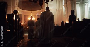 Liturgy in Grand Church: Majestic Procession Of Priests Walking with Processional Cross to Altar. Congregation Stands In Reverence, Christians Rejoice In Mass Ceremony. Slow Motion Back View