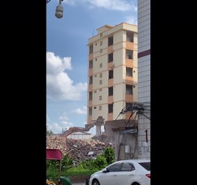 Building demolition mishap with excavator in Guangxi, China