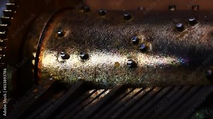 Inner mechanism of a music box made of metal. Turning barrel and cogs of the antique music box. Extreme close up of Musicbox clockwork mechanism