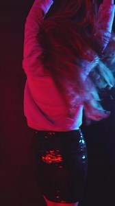 Woman Dancing Under Red and Blue Lights Cinematic Club Scene Vertical