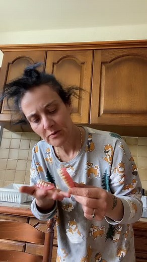 Demonstrating Dentures in a Cozy Kitchen Setting