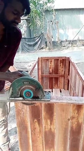 Wood is cut by hand machine