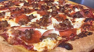 Pizza Hoss owner Justin Holmes battles personal loss to keep restaurant going strong