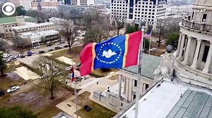 Mississippi started flying its new flag at the State Capitol in Jackson on Monday (1/11). It includes a magnolia and the phrase "In God We Trust." Last year, the state voted to replace the previous state flag design, which included a Confederate symbol. | News 8 Now / News 8000