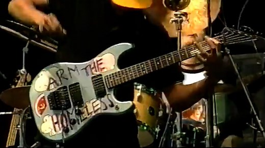 Rage Against the Machine guitarist Tom Morello tells us how his iconic "Arm the Homeless" custom guitar came into being. | Loudwire