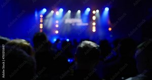 The view from the auditorium to the stage in the concert hall above the heads of the audience. The long wait for a musical star at a concert. Artists are always late for concerts. High quality 4k