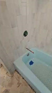tub surround renovation. glazed ceramic tiles. 4x16 set on a 1/3 bond. Laticrete Steamship grout