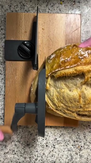 This artisan Bread Slicing with manual Classic Hand Crank Cutter for Crisp, Perfect Loaf Cuts #food