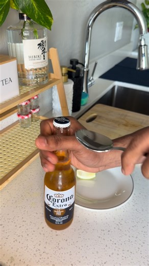 The curry method on Instagram: "Chef trick to open BEER 🍺🥄 #shortshorts #lifehacks #chefhacks #corona #beer"