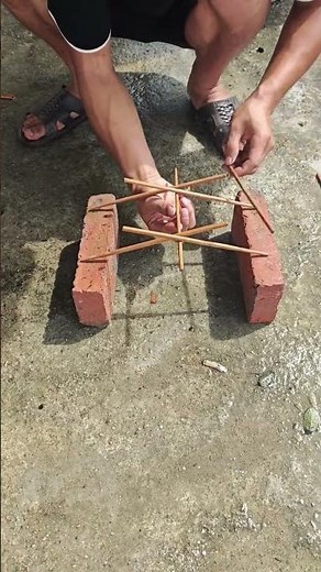The construction process of a load-bearing arch bridge model with chopsticks