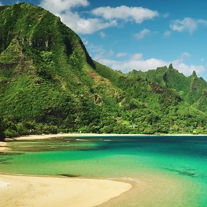 85K views · 1.1K shares | Afternoon Escape! Who wants to spend Hump Day in Hawaii? : Kalalau Beach, Kauai, Hawaii | Coastal Living | Facebook