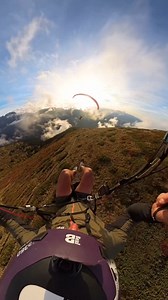 Sunset paragliding flight over stunning landscapes