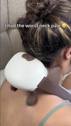 Using electric massager after work for relax back and shoulders, feel like a real massage at home