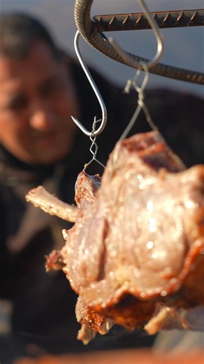 Tender meat cooked over an open flame, infusing it with smoky flavors and rustic charm. A timeless outdoor cooking experience. #OpenFlameCooking #SmokedMeat #OutdoorCooking #Cooking | Wilderness Grill