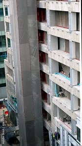 Time lapse of a high-rise building under construction, showcasing scaffolding, structural elements, and the intricate process of urban development.
