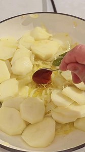 PSARI PLAKI – GREEK BAKED FISH WITH POTATOES & TOMATO Ingredients • 4 fish fillets (cod or any firm white fish) • 5 potatoes, thinly sliced • 5 ripe tomatoes, grated or finely chopped • 1 large onion, finely sliced • 4 garlic cloves, minced • ½ bunch fresh parsley, chopped • 1 tbsp tomato paste • 1 glass dry white wine • Zest of 1 lemon • Salt, pepper, oregano • 100 ml extra virgin olive oil • 1 tbsp capers Method 1. In a deep baking dish, heat the olive oil over very low heat and gently sauté t