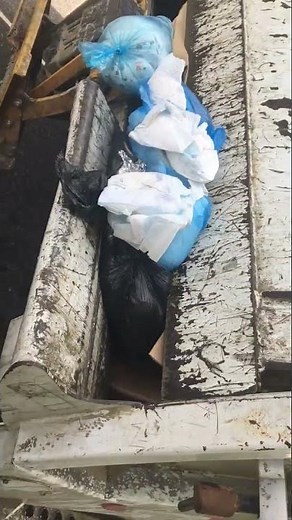 Packing garbage and diapers in the trash