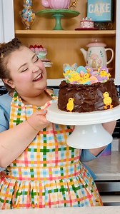 The cutest bird's nest cake topped with hand-piped Candy Melts chicks and eggs created for Wilton by Sweet Kate Bakery - just in time for Easter! 🪺🎂🐣🥚 | Wilton Cake Decorating