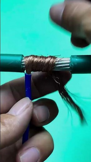 How to demonstrate the process of securing copper wire to an electrical cable, including components