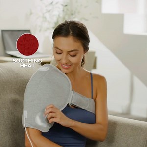 Calming Heat Shoulder Wrap fits perfectly on either one of your shoulders to help soothe and relax stiffness and tired muscles. #calmingheat | Calming Heat Massaging Heating Pad | Facebook