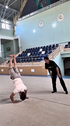 Ruslan Fayziyev 🇺🇿 on Instagram: "🔥Don’t call it hard until you try. You might surprise yourself💥 . . . . . #calisthenics #tutorial #streetworkout #workout #gymnastics #acrobatics #handstand"