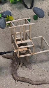 The log treehouse on the stump, with a wooden ladder set up, exudes a rustic charm of the forest. #miniaturescene #minihouse #forestcabin #woodencottagevilla #forestcabin | Mini Devil