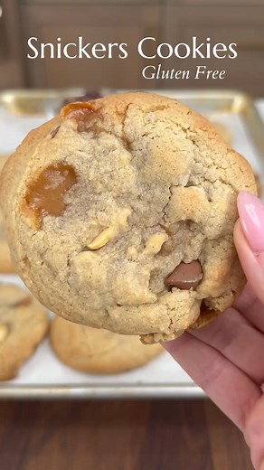 These snicker cookies are straight-up dangerous 🤣 Sweet, salty, loaded with caramel, peanuts, and chocolate—basically a candy bar in cookie form 🍪🔥Comment "snicker cookies" and I’ll DM you the recipe! #snickercookies #cookierecipe #caramelcookies #sweetandsalty #bakingreel #easybaking #summerdessert #chocolatepeanutcookies | The Salty Cooker