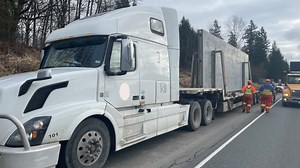Truck strikes overpass in Langley