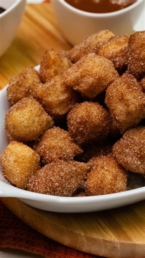 Game day spreads may be known for savory snacks—but every winning lineup needs something sweet, too. 🎉🍩 These Churro Bites are the perfect way to end the feast on a high note. 🔸INGREDIENTS: 1/4 cup unsalted butter, cubed 1 cup water 1 tablespoon granulated sugar 1/4 teaspoon salt 1 cup all-purpose flour 1 large egg 1 teaspoon vanilla extract Oléico®, for frying 1/2 cup granulated sugar 2 teaspoons ground cinnamon Cajeta or chocolate suace for dipping (optional) 🔸INSTRUCTIONS: Fill a deep sau