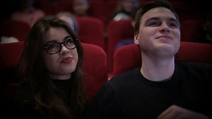 Couple in love watching a movie at the cinema - Free Stock Video