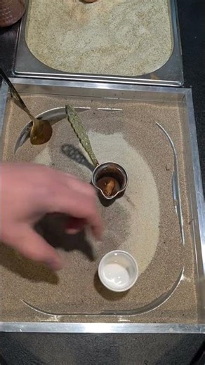 How Turkish coffee is made in hot sand.
