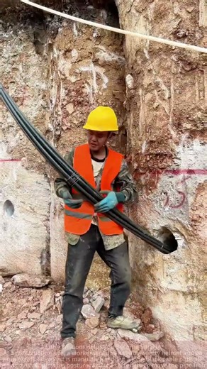 Construction Worker Handles Long Cable Pipe with Strength and Skill!