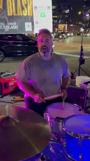 Drummer outside T-Mobile drums his feelings after grand slam