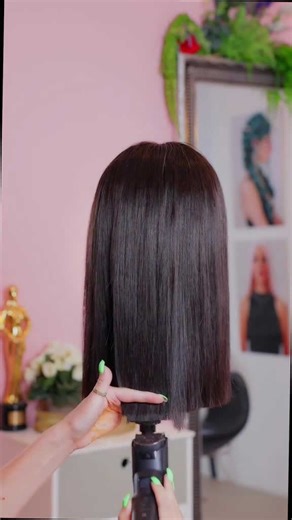 Satisfying one length clipper cut on sleek dark bob