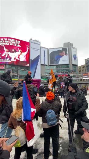 Police pushing back pro protesters to not get closer to anti protesters. Toronto