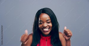 Black woman, smile and thumbs up in studio, yes and positive review or feedback, agreement and mockup. Happy female person, emoji and icon or sign, portrait and celebrate or face by gray background