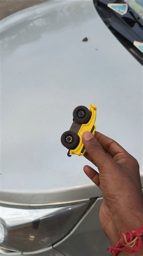 yellow high speed mini magnetic car carke bonnet ke upar chalaya