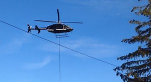 Helicopter moves heavy equipment to NE Portland school roof
