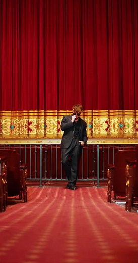 Dynamic Dance Performance in Elegant Theater Setting