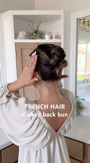 French pin slicked back bun hairstyle