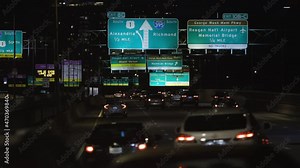Cars Drive on 14th Street Bridge on Interstate 395 in Washington DC at Night