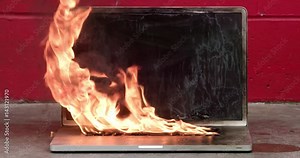 Laptop computer on fire and burning intensely