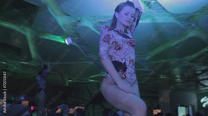 Young go-go dancer moving to music, moving hot to music Stock Video