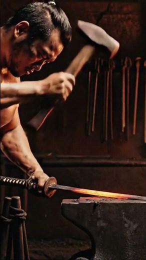 Hammering glowing hot steel on an anvil with focused intensity.