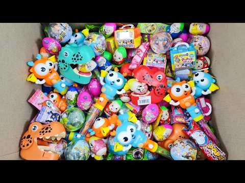Unpacking Box Full Of Surprise Ball, Cute Lollipop, Chocolate Bean and Satisfying Gift Inside