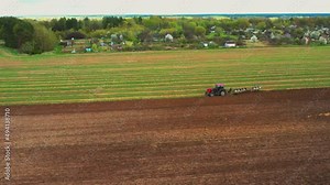 Rural Landscape. Tractor Plowing Field In Spring Season. Beginning Of Agricultural Spring Season. Cultivator Pulled By A Tractor In Countryside Rural Field. Stock Video